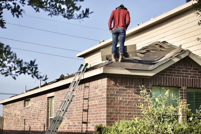 Professional roofer working on a residential roof in Downtown Pasadena